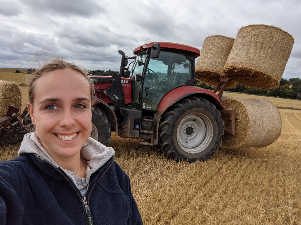 Alicja Blaz in field next to tractor