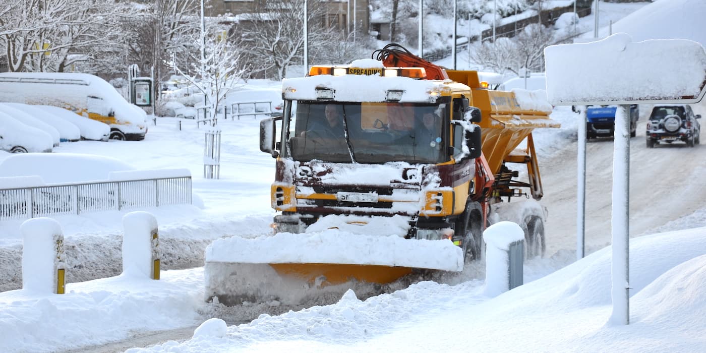 picture of a snow plough in adverse weather
