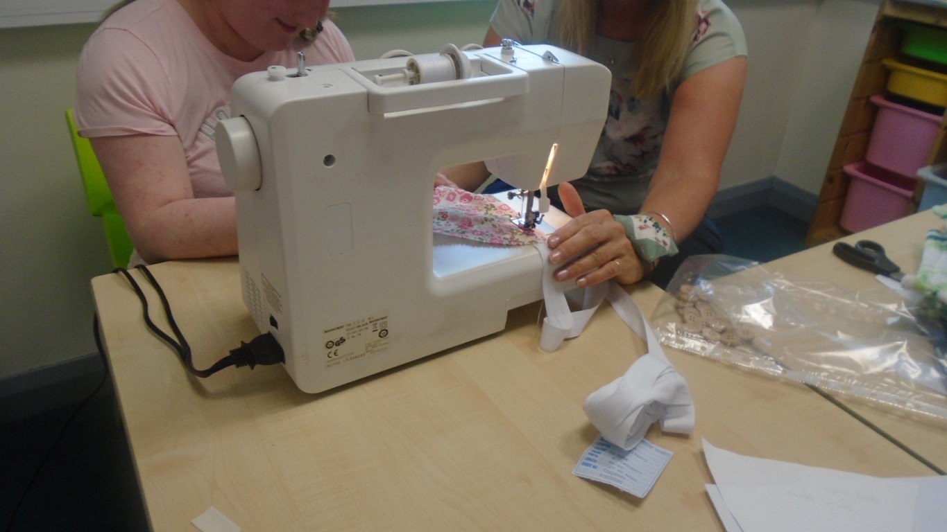 People using sewing machine