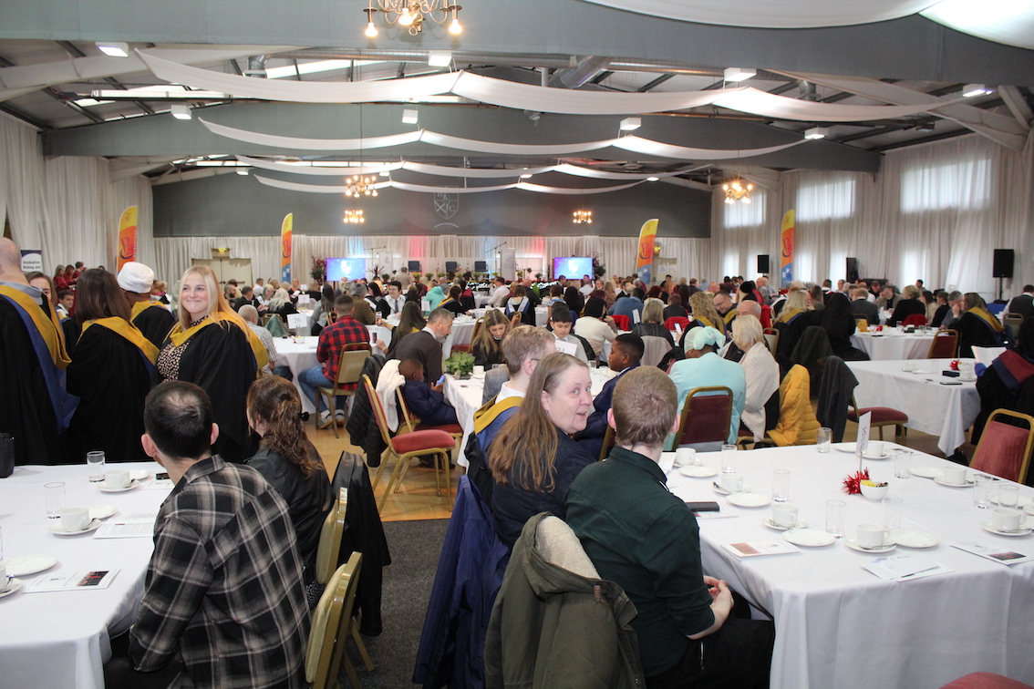 Graduation attendees in hall