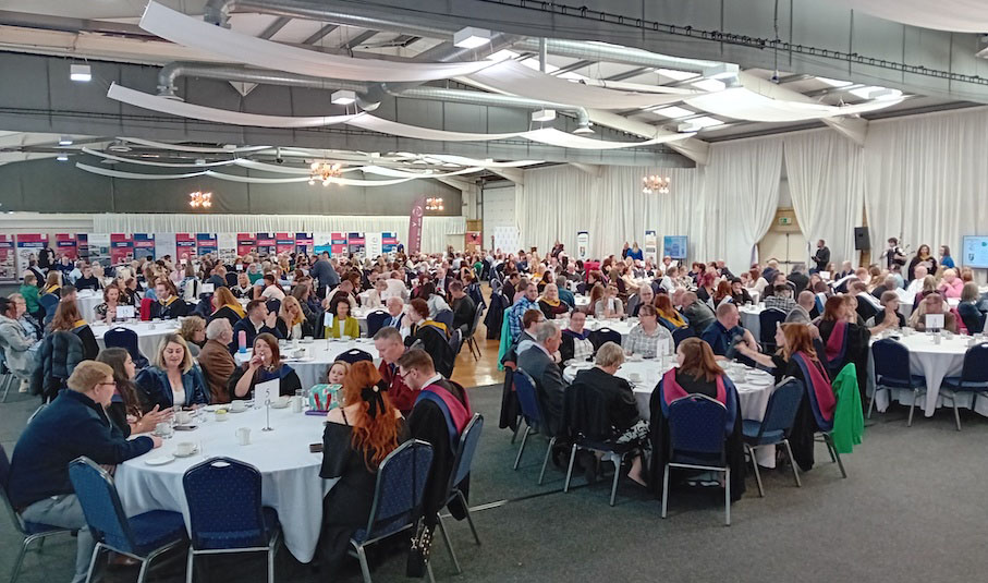 photo of graduation party sitting at tables