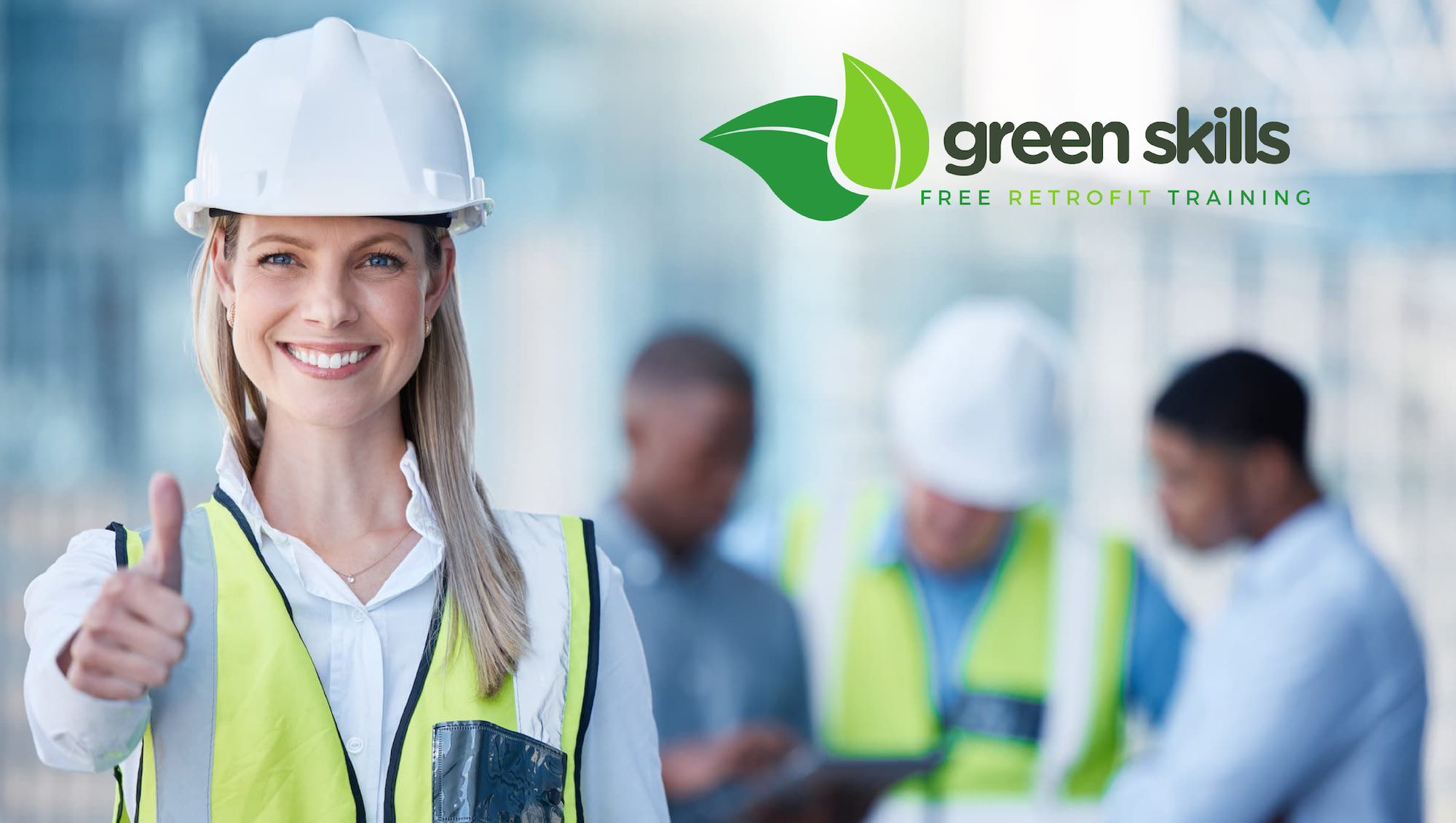 Woman standing with hard hat on giving the thumbs up