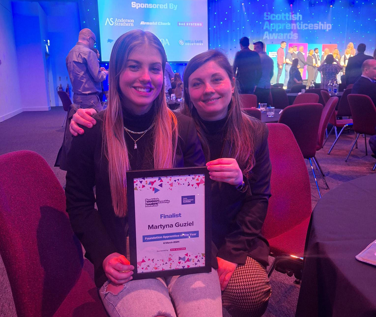 Martyna pictured holding a certificate alongside her mum at the awards