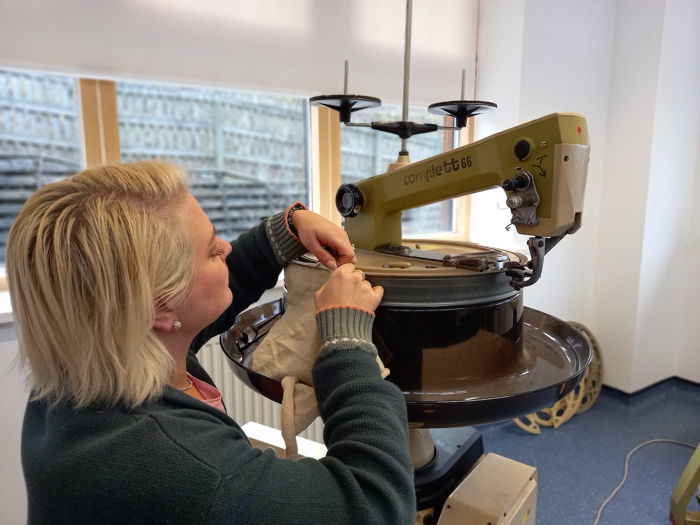 Woman using textile equipment