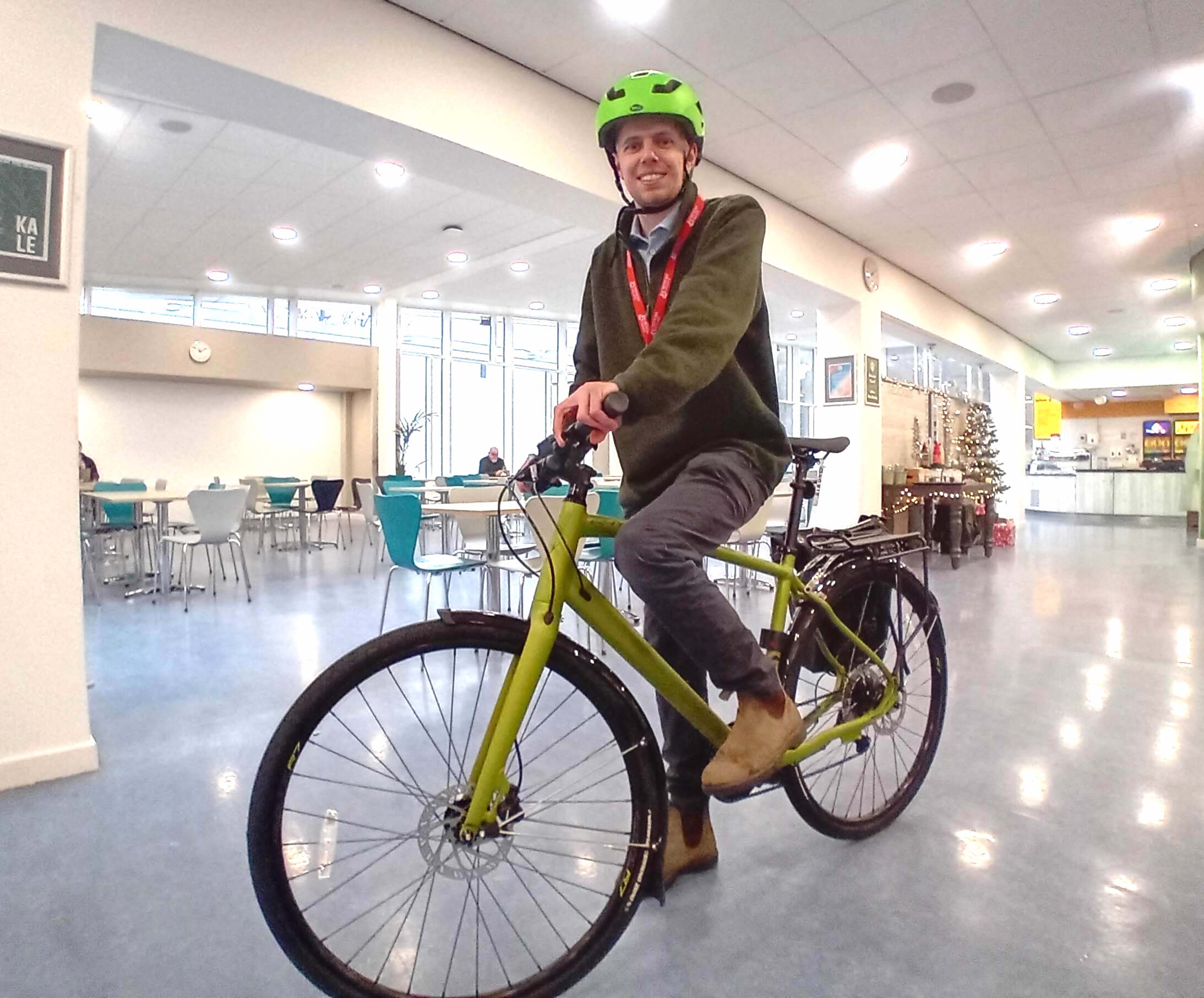 Person sitting on a bike indoors