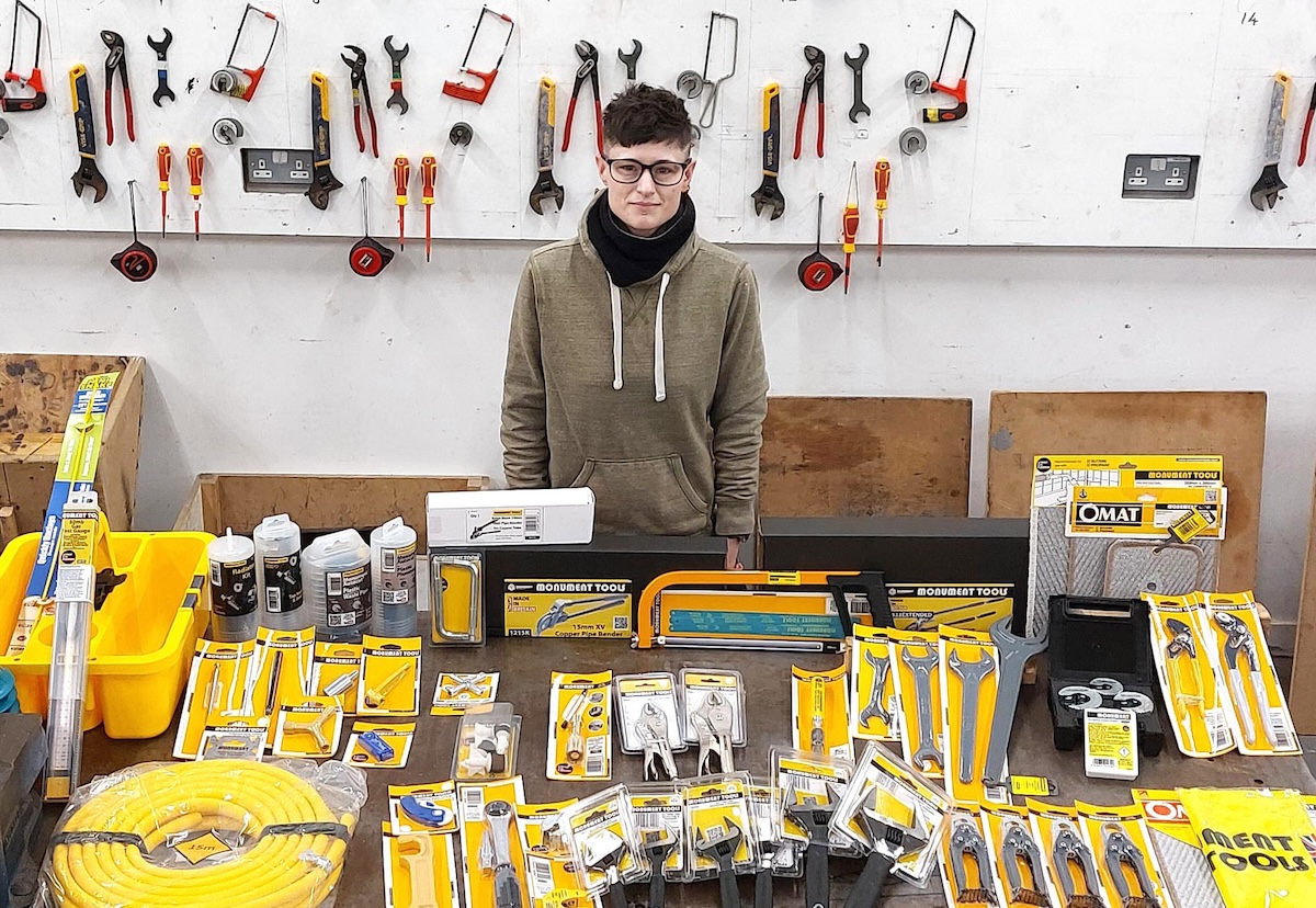 Photo of Teresa Collins standing at a work bench