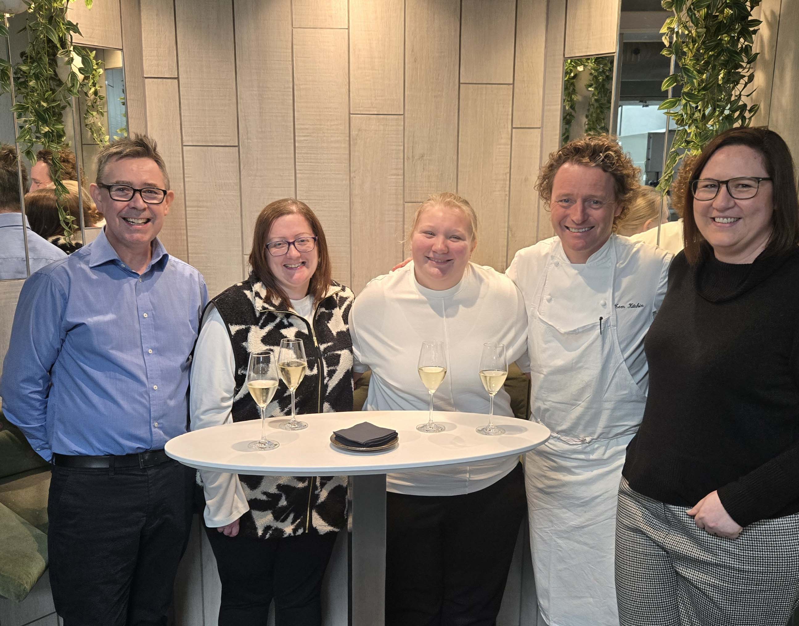 Group of staff and students standing with chef Tom Kitchin