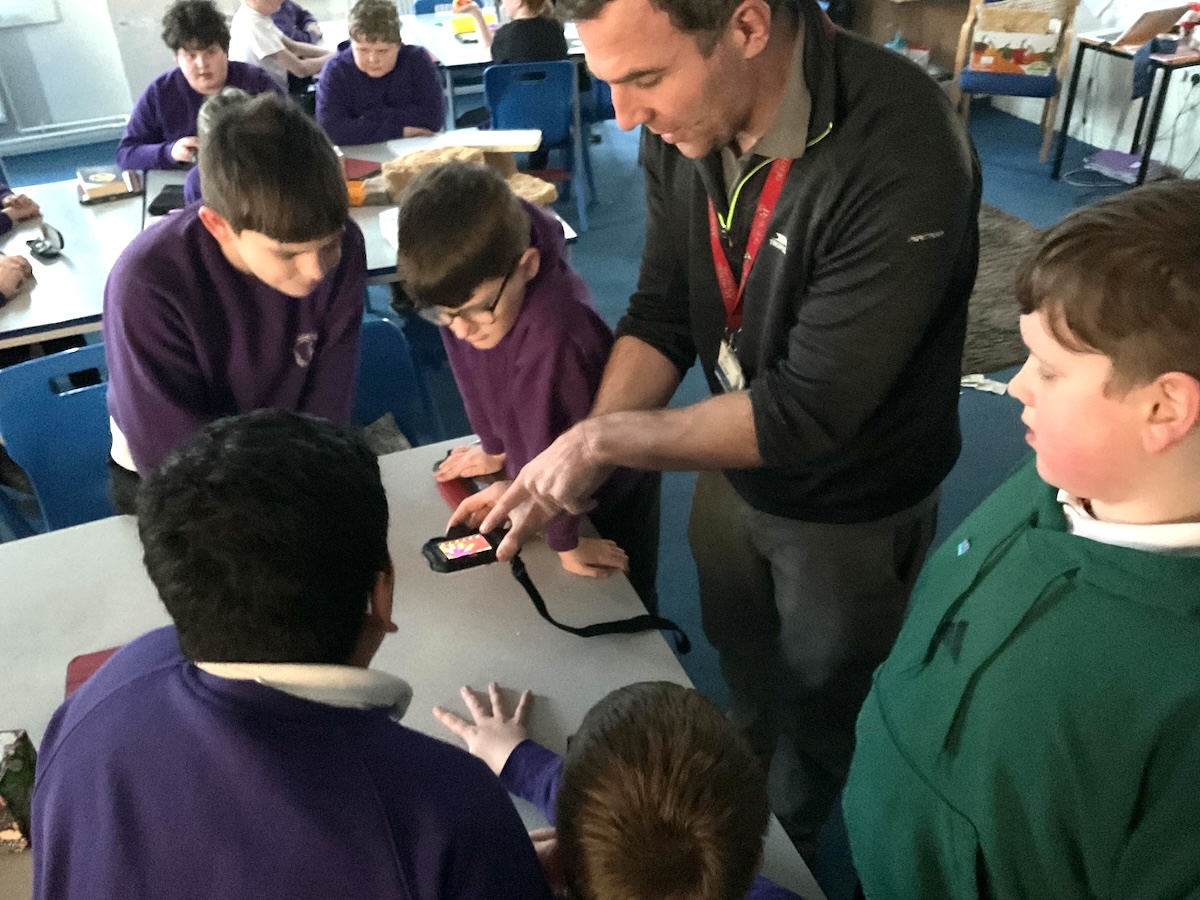 Photo of school pupils learning about sustainability in a classroom setting