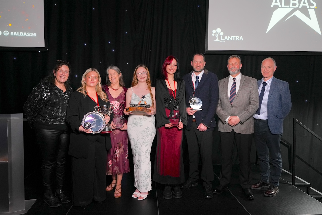 Group of Borders College staff and students standing on a stage at the ALBAS Awards Ceremony