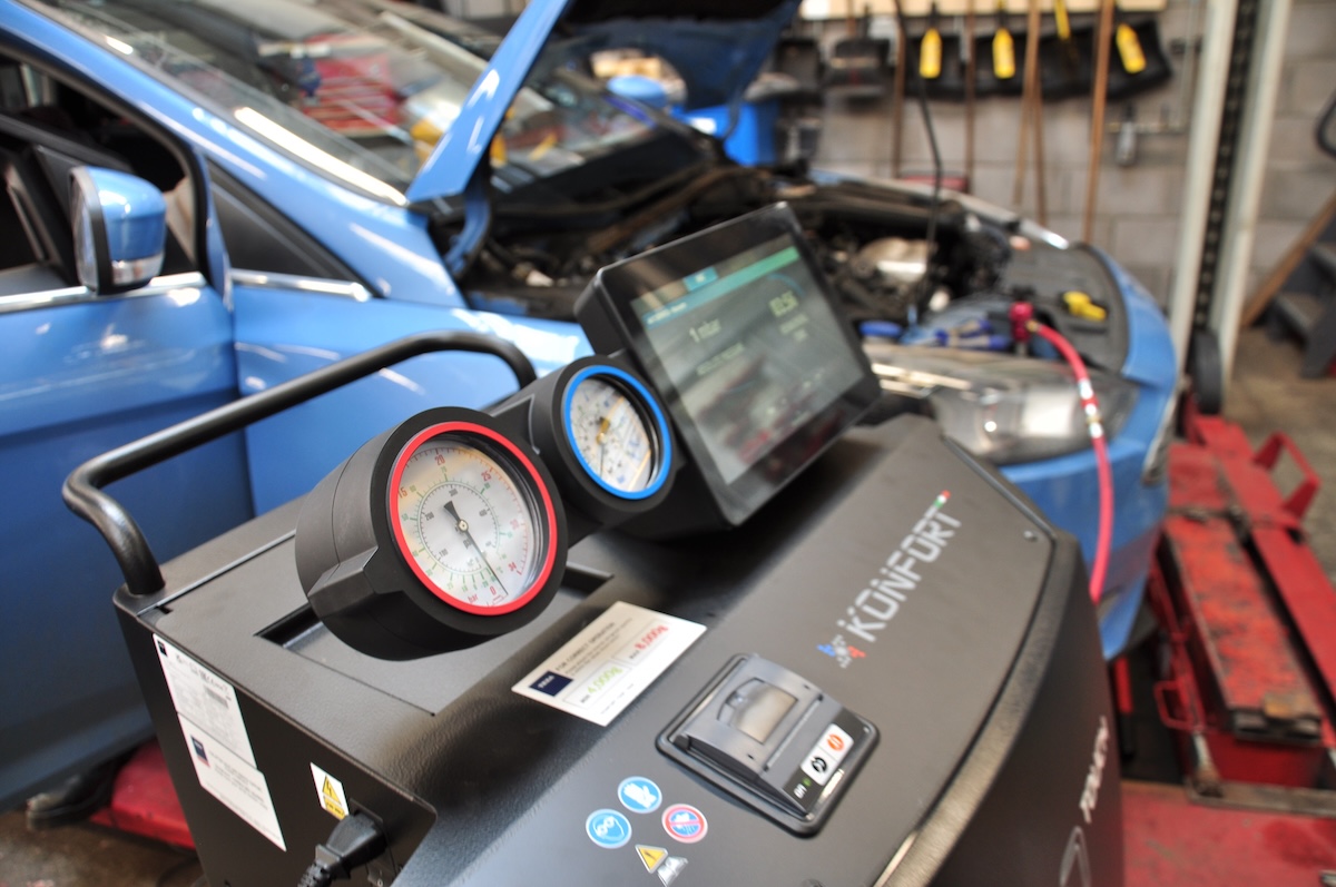 Photograph showing motor vehicle air conditioning servicing equipment