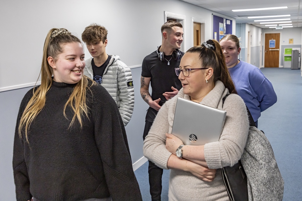 Group of students walking in a corridor