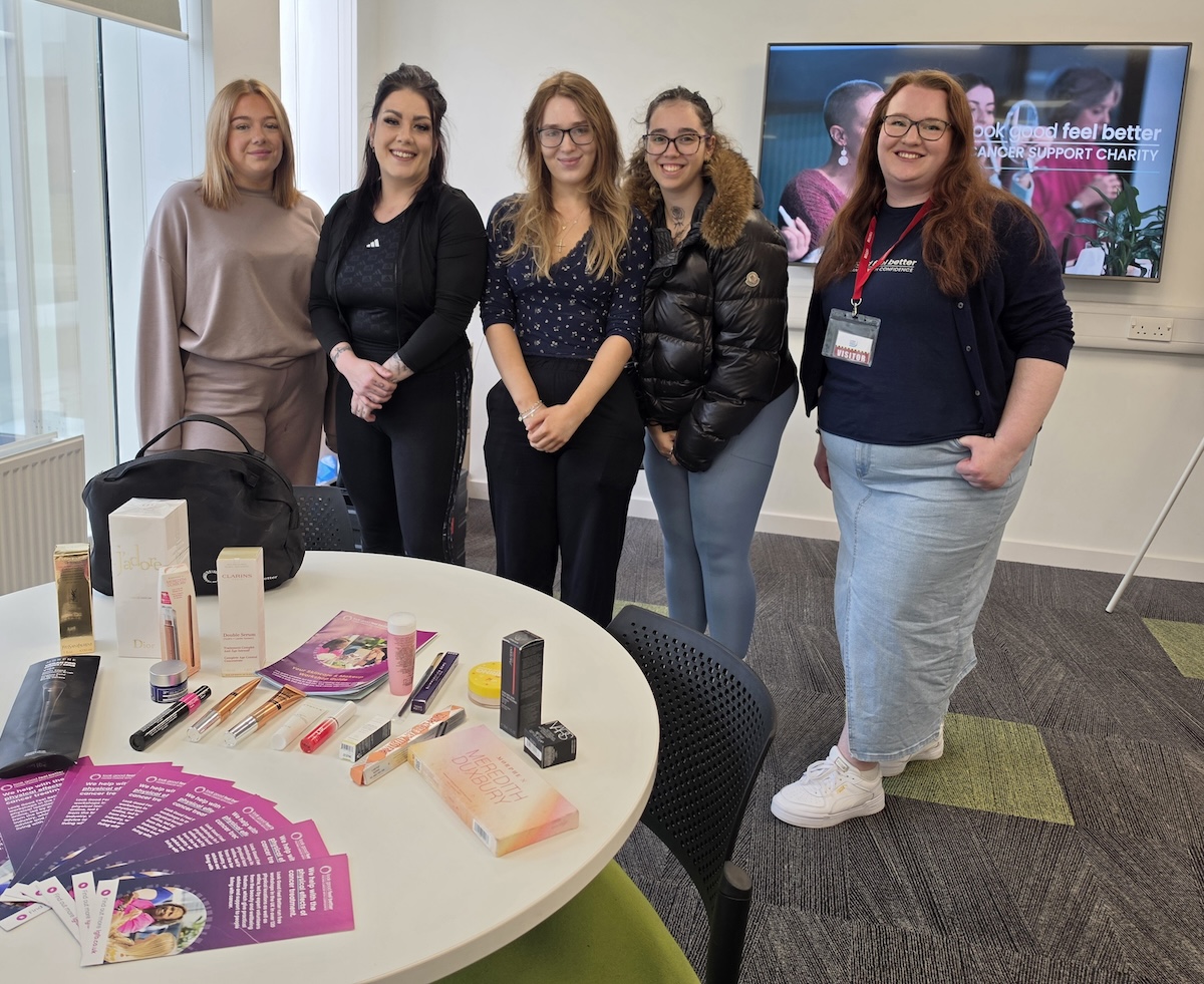 Five people pictured standing in a classroom setting at the Scottish Borders Campus