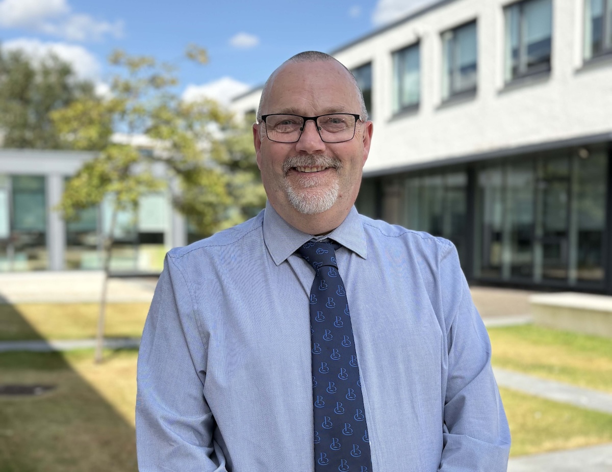 Photograph of Davie Lowe standing outside the Scottish Borders Campus